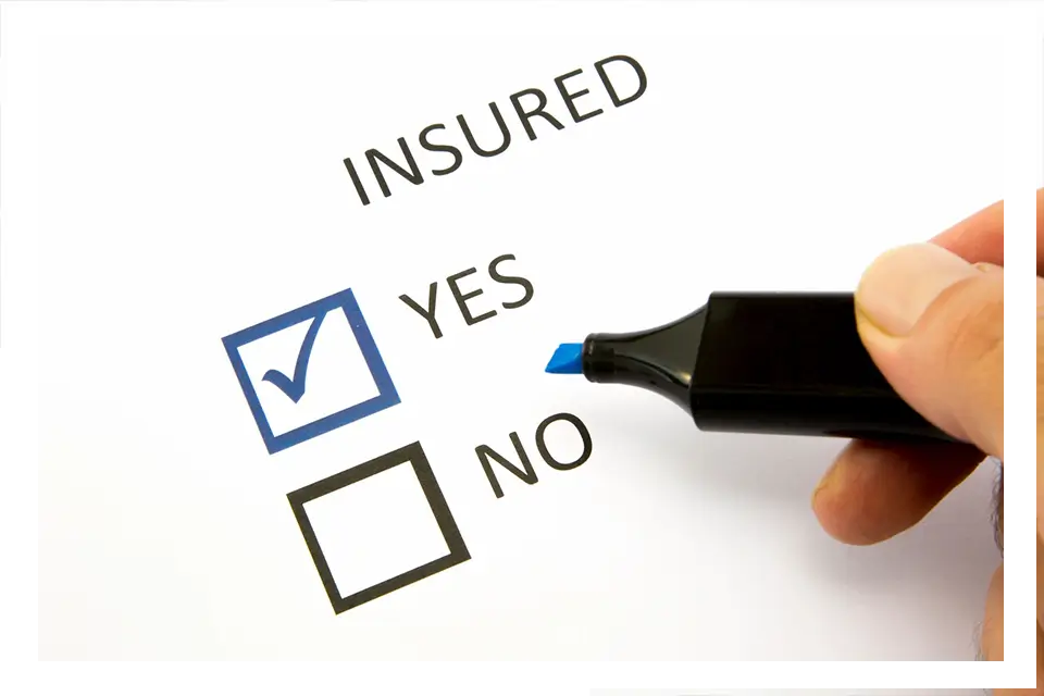 A person is filling out an insured questionnaire.