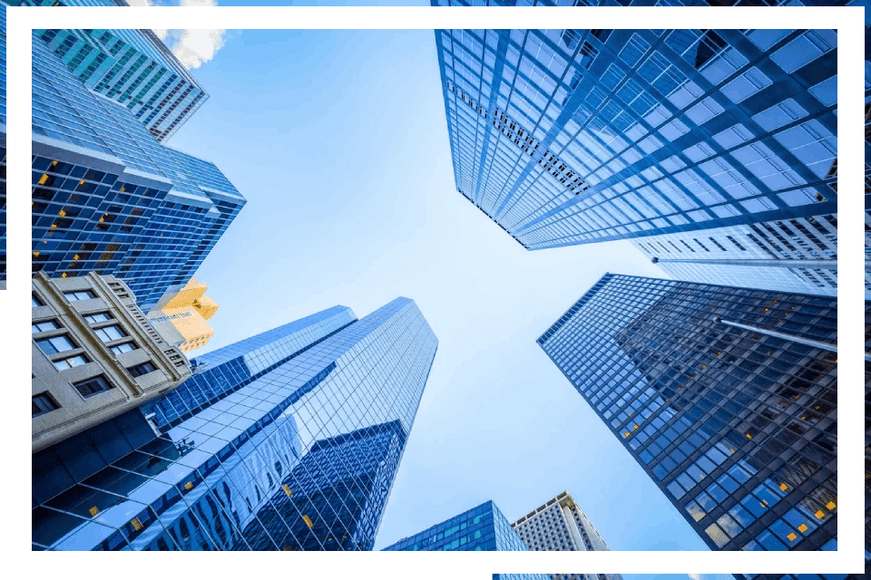 Here's an alt tag for the image: Modern skyscrapers reaching for the sky.