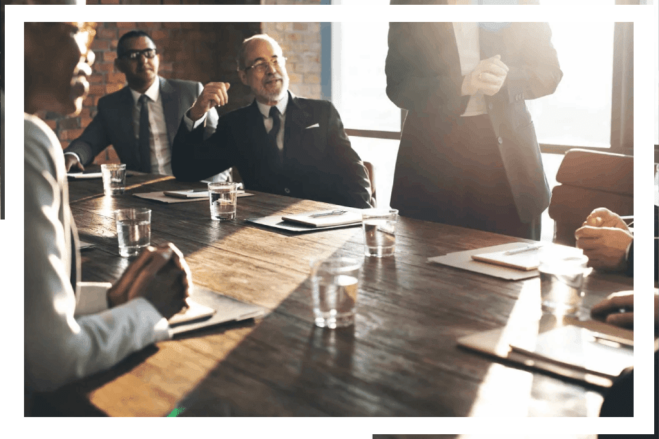 Business people meeting around a table.