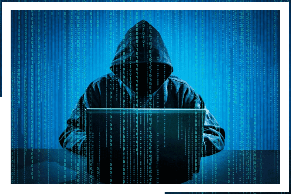 Hooded hacker using laptop, binary code.