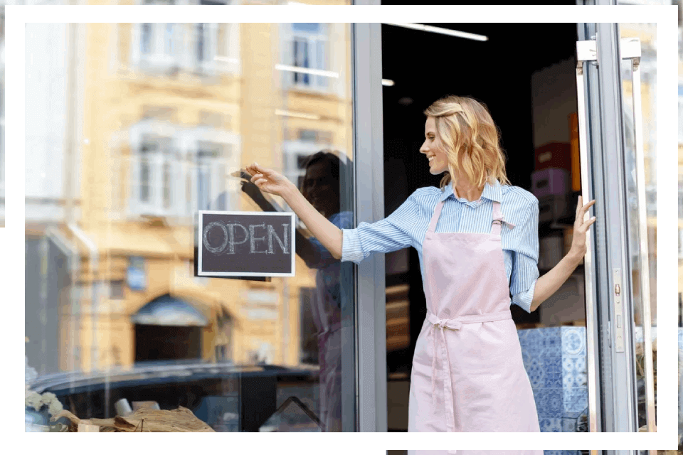Woman opening small business shop.